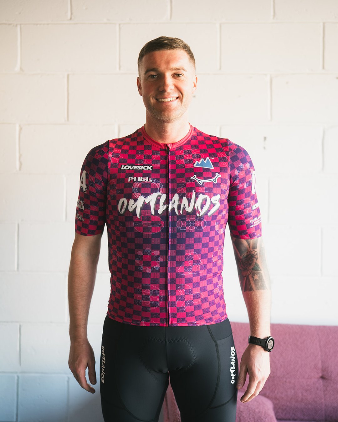 An Outlands race team rider in the DONTBECHECKERS jersey
